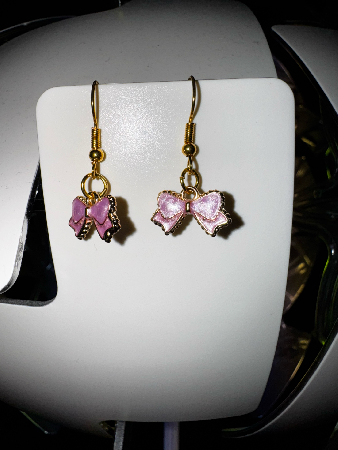 reringe i guld med pink snrebnd